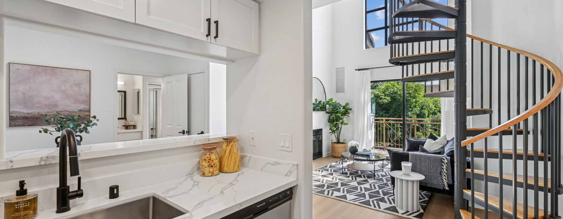 Renovated kitchen and living area of an apartment home at Pasadena Gateway Villas